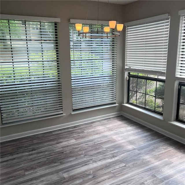 3045 Steeplechase, Alpharetta, GA 30004 - unfurnished dining area with baseboards and wood finished floors