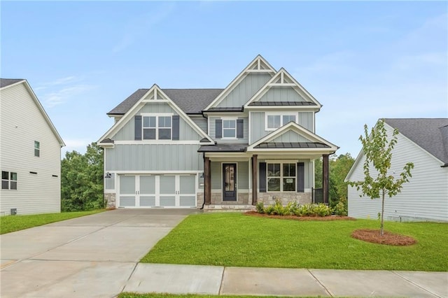 craftsman inspired home featuring covered porch, a front yard, and a garage