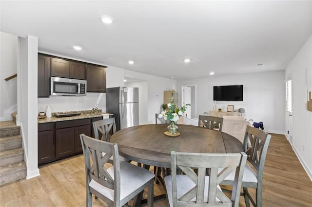 dining space featuring light hardwood / wood-style floors