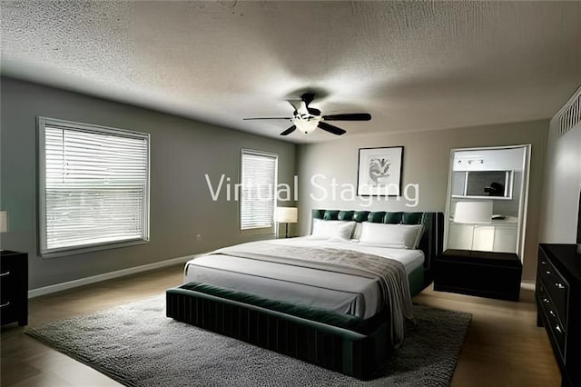 bedroom featuring ceiling fan, a textured ceiling, and baseboards