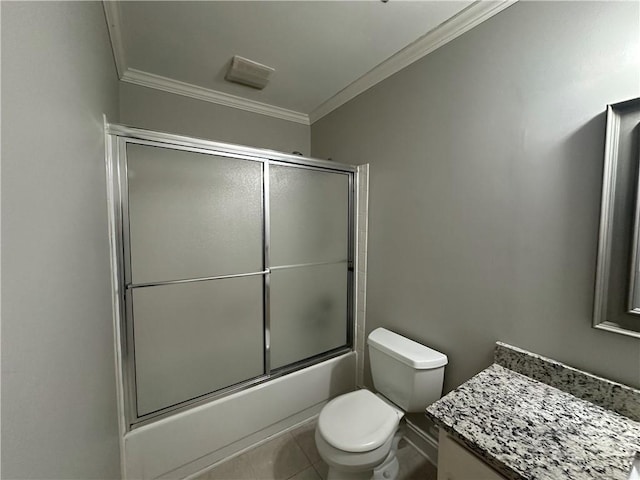 bathroom with tile patterned floors, toilet, shower / bath combination with glass door, and ornamental molding