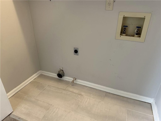 laundry area with hookup for a washing machine, light tile patterned floors, baseboards, hookup for an electric dryer, and hookup for a gas dryer