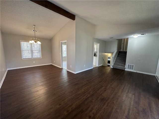 spare room featuring stairway, visible vents, lofted ceiling with beams, dark wood-style flooring, and a chandelier