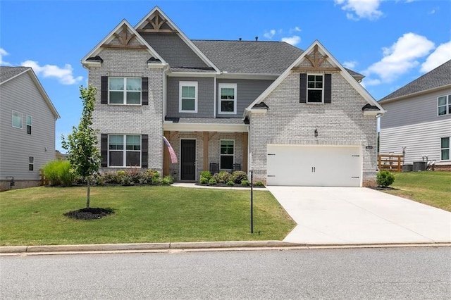 craftsman-style home with central AC, a front lawn, and a garage