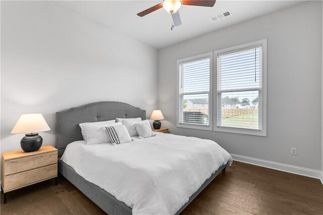 bedroom featuring dark hardwood / wood-style floors and ceiling fan