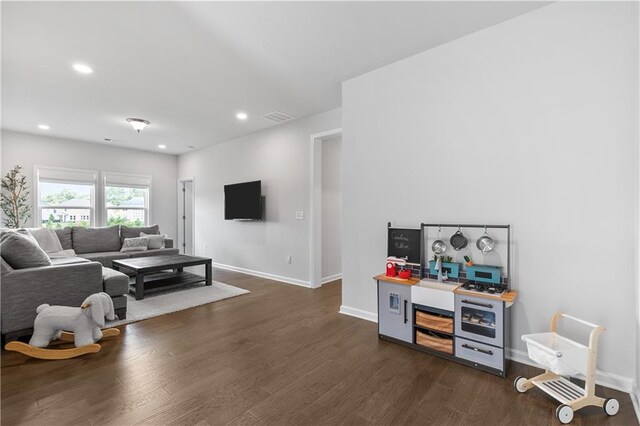 living room with dark wood-type flooring