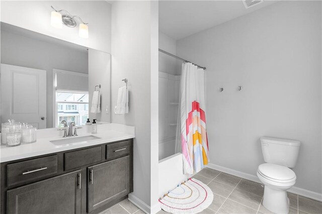 full bathroom featuring vanity, tile patterned flooring, toilet, and shower / bathtub combination with curtain