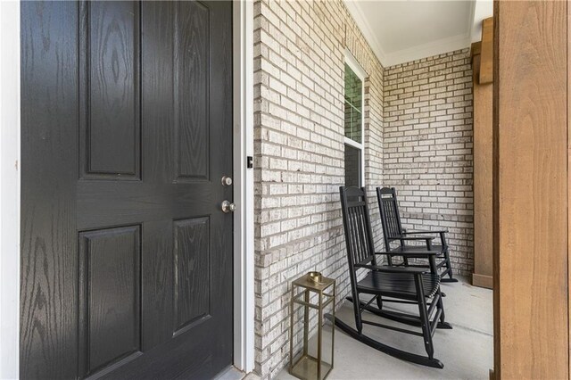 doorway to property with a porch