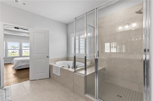 bathroom with wood-type flooring and separate shower and tub