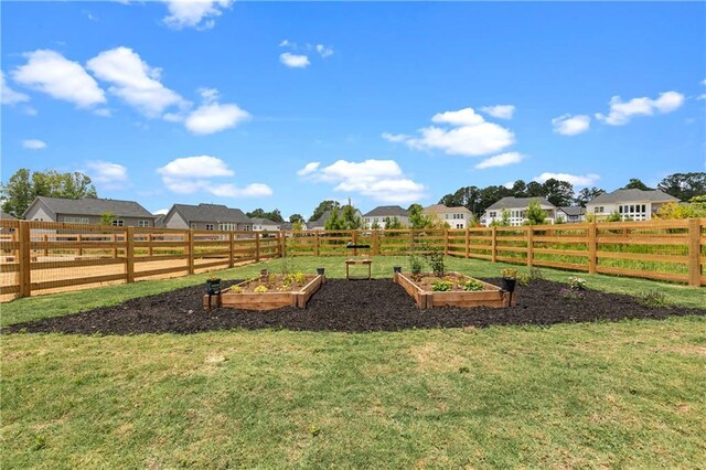 view of storm shelter with a lawn and a rural view