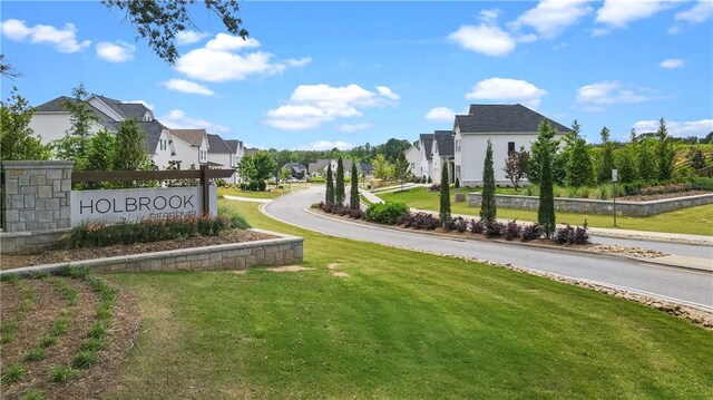 view of property's community with a yard