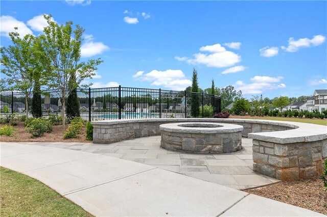 view of patio featuring a fire pit