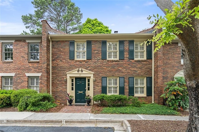 view of front of house with brick siding