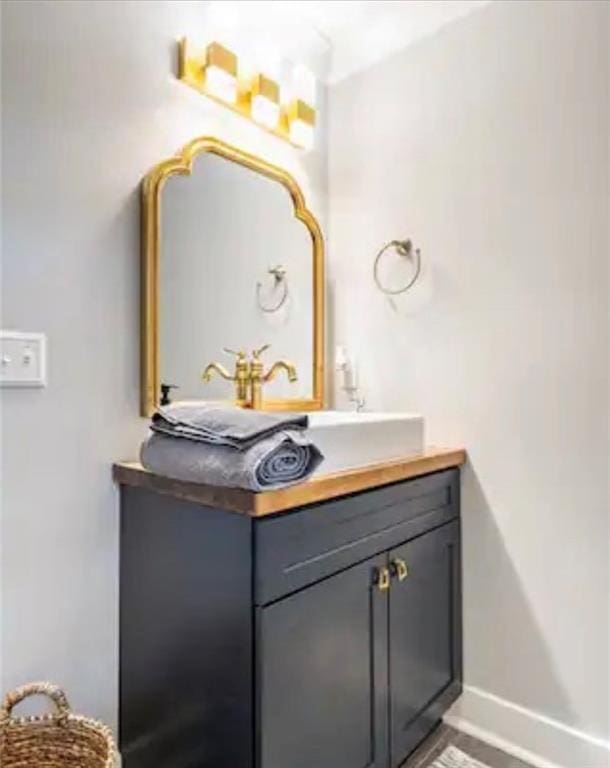 bathroom featuring vanity with extensive cabinet space