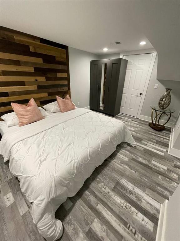 bedroom featuring dark wood-type flooring