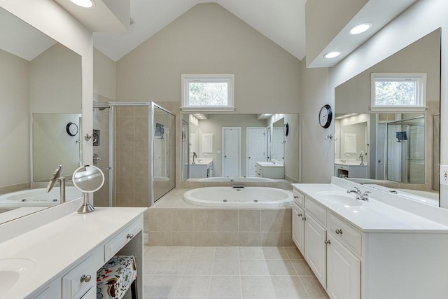 bathroom with vanity, high vaulted ceiling, separate shower and tub, and a wealth of natural light