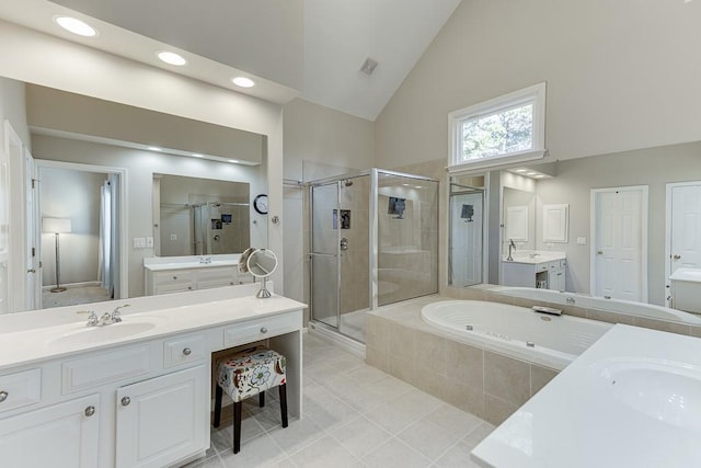 bathroom featuring tile patterned floors, vanity, high vaulted ceiling, and shower with separate bathtub