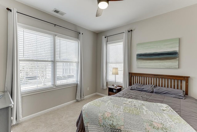 bedroom with ceiling fan and carpet floors