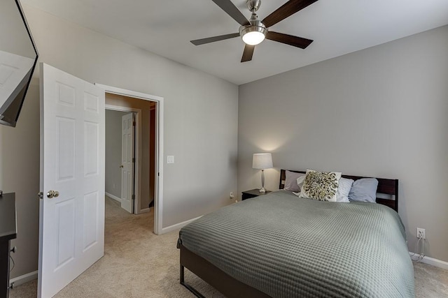 bedroom with ceiling fan and light colored carpet