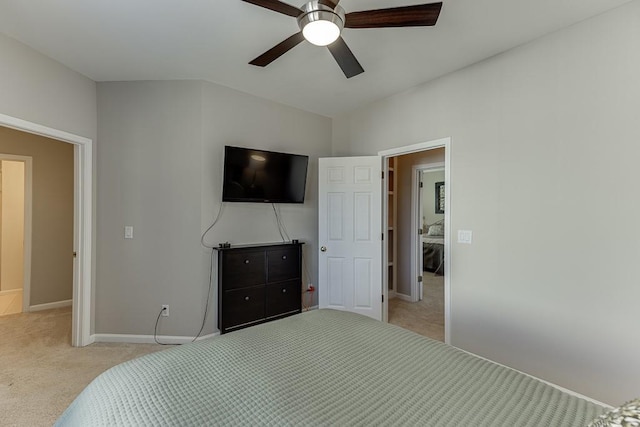 bedroom with ceiling fan and light colored carpet