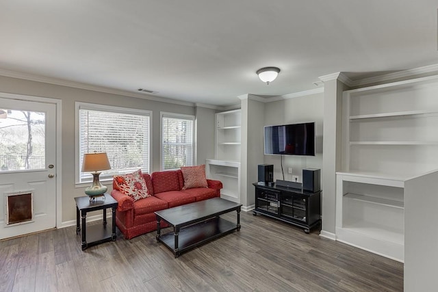 living room featuring hardwood / wood-style floors, built in features, and a wealth of natural light