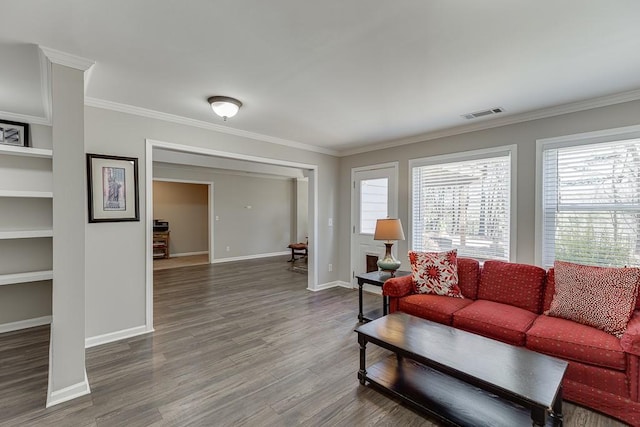 living room with hardwood / wood-style flooring and crown molding