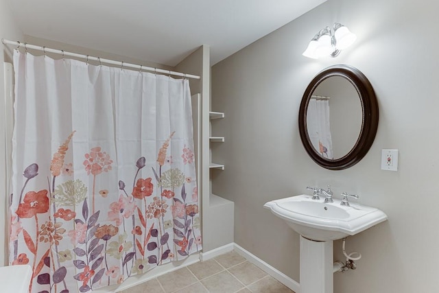 bathroom featuring tile patterned floors and a shower with shower curtain