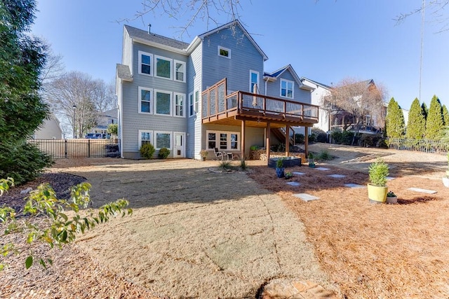 rear view of house featuring a deck