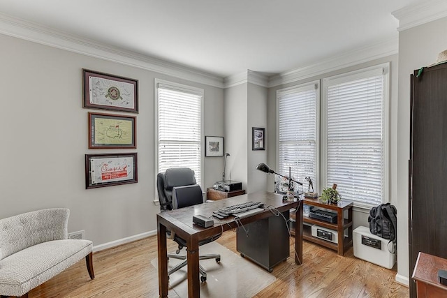 office area featuring light wood-type flooring and crown molding