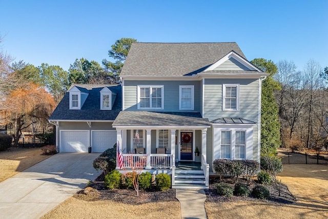 front of property featuring a porch and a garage