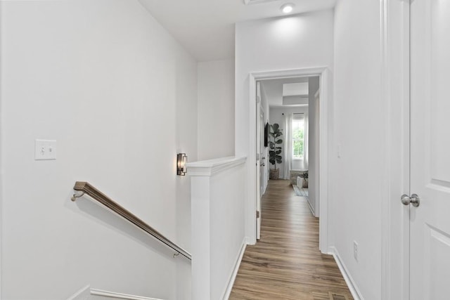 hall with wood-type flooring