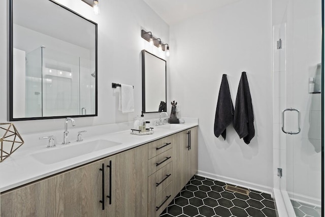 bathroom with walk in shower and vanity