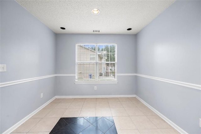 1486 Rogers Crossing Dr, Lithonia, GA 30058 - tiled spare room with a textured ceiling and baseboards
