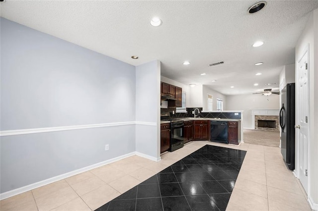 1486 Rogers Crossing Dr, Lithonia, GA 30058 - kitchen featuring black appliances, light tile patterned floors, open floor plan, ceiling fan, and tasteful backsplash