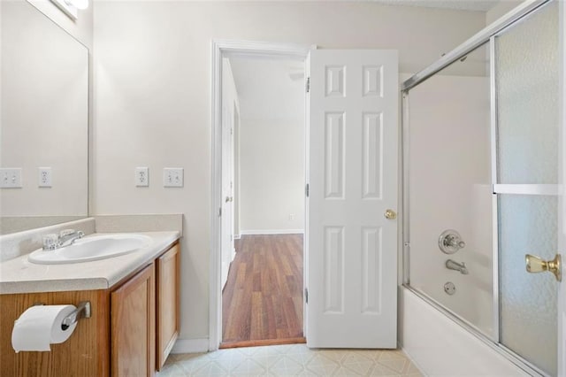 1486 Rogers Crossing Dr, Lithonia, GA 30058 - full bathroom with vanity, bath / shower combo with glass door, tile patterned floors, and baseboards
