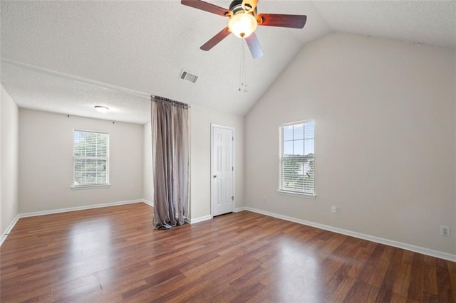 1486 Rogers Crossing Dr, Lithonia, GA 30058 - unfurnished bedroom with wood finished floors, lofted ceiling, baseboards, and ceiling fan