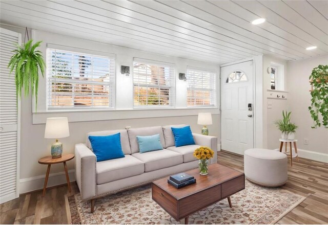 sunroom / solarium featuring wooden ceiling