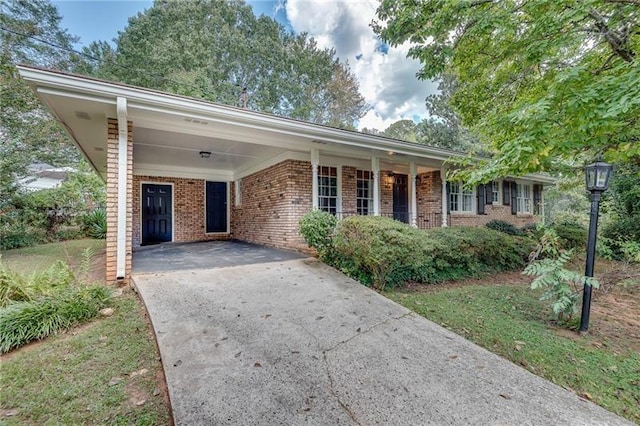 ranch-style home with a carport