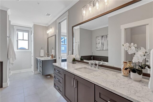 bathroom featuring vanity, crown molding, and tile patterned floors