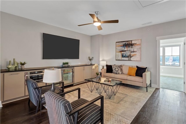 living room with wood-type flooring, wine cooler, and ceiling fan