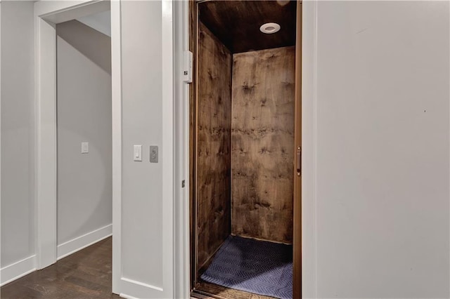 bathroom with hardwood / wood-style floors