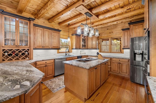 5505 Whitehall Rd, Lula, GA 30554 - kitchen featuring a sink, light wood-style floors, brown cabinets, and appliances with stainless steel finishes