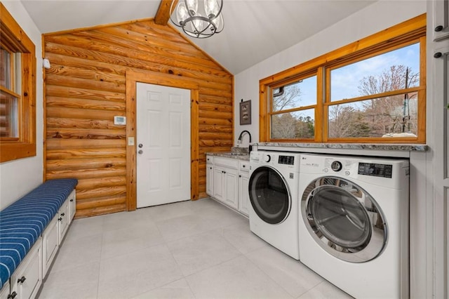 5505 Whitehall Rd, Lula, GA 30554 - clothes washing area with washing machine and dryer, a sink, a chandelier, light tile patterned floors, and cabinet space