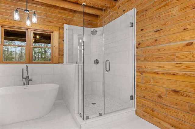 5505 Whitehall Rd, Lula, GA 30554 - bathroom with a freestanding tub, wooden walls, and a shower stall
