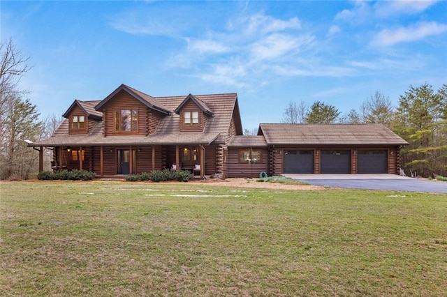 5505 Whitehall Rd, Lula, GA 30554 - cabin featuring log siding, a front yard, aphalt driveway, and an attached garage