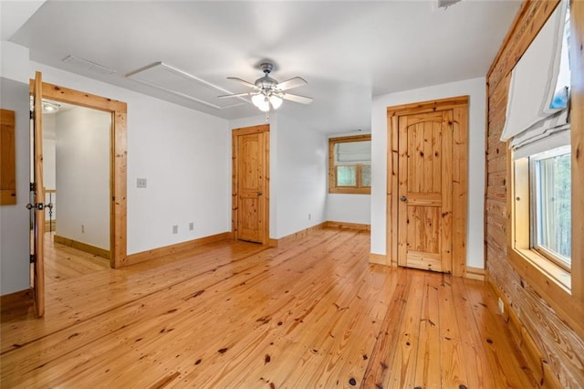 5505 Whitehall Rd, Lula, GA 30554 - unfurnished bedroom with attic access, light wood-type flooring, baseboards, visible vents, and ceiling fan