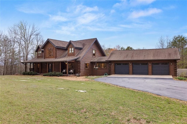 5505 Whitehall Rd, Lula, GA 30554 - log home featuring log siding, a front yard, driveway, and an attached garage