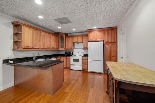 5505 Whitehall Rd, Lula, GA 30554 - kitchen featuring open shelves, white appliances, a sink, a peninsula, and brown cabinets