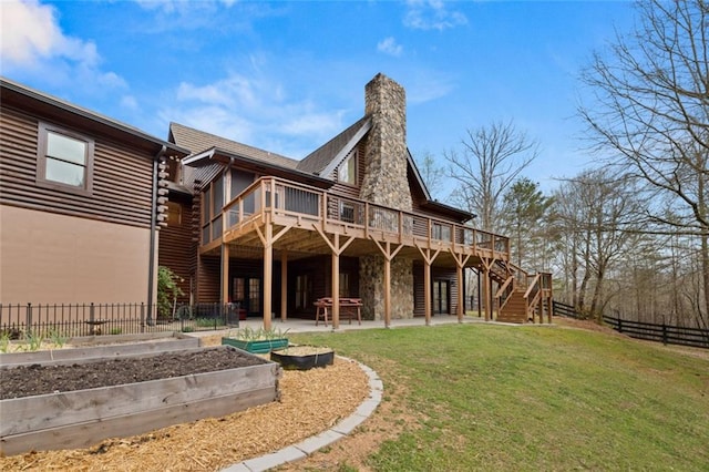 5505 Whitehall Rd, Lula, GA 30554 - rear view of house featuring fence, a wooden deck, a yard, stairway, and a vegetable garden
