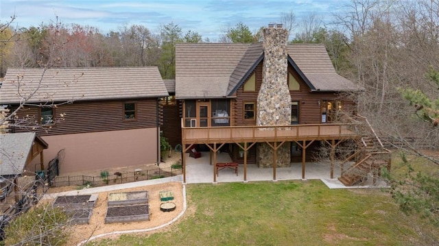 5505 Whitehall Rd, Lula, GA 30554 - back of house with a lawn, log siding, a deck, a patio area, and a chimney